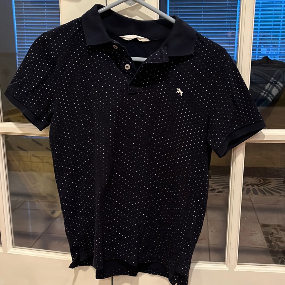 Boys navy blue polo.  Size large. Navy blue with white dots